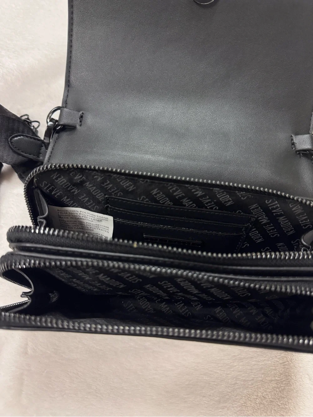 Steve Madden Black Embossed Logo Crossbody Bag.